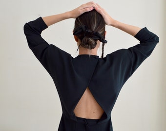 structured cut out back black mini strong shoulder dress