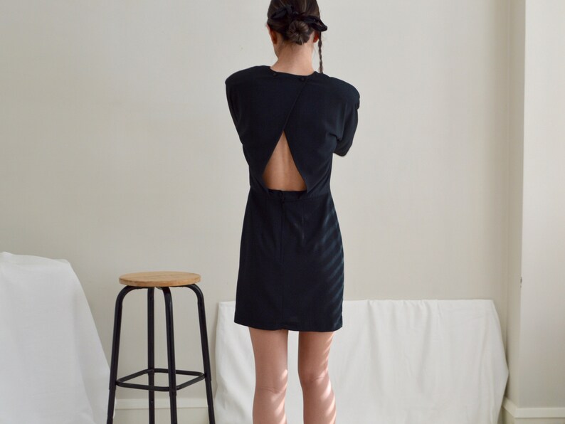 structured cut out back black mini strong shoulder dress image 6