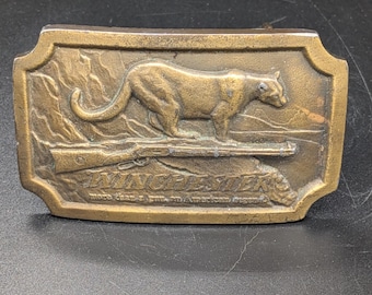 Klamra mosiężna do karabinu Winchester z lat 70. z motywem pumy