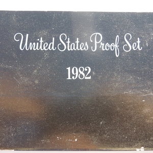 May include: Black cardboard box with white text that reads "United States Proof Set 1982".