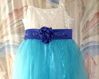 Special occasion customizable dress shown in teal tulle and satin, ivory lace and satin and purple satin
