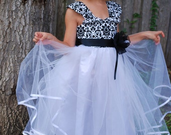 Black and white damask bodice embellished with hand made flower attached to billowy white tulle skirt with white satin lining.