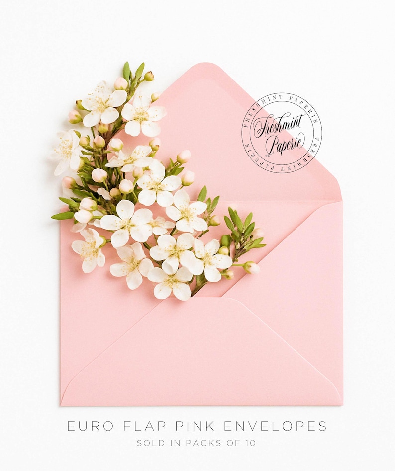 May include: Pink euro flap envelopes with a white flower arrangement on top. The envelopes are sold in packs of 10. The image includes the text "Freshmint Paperie".