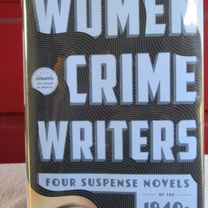 May include: A book cover for "Women Crime Writers" featuring the title in large white letters against a black and gray wavy background. The cover includes the text "Four Suspense Novels of the 1940s" and an illustration of a woman's eye.