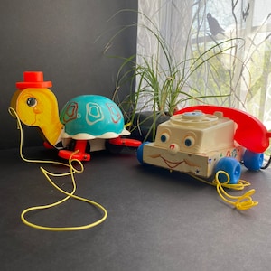 vintage Fischer Price turtle and telephone pull toys