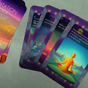 May include: A set of colorful oracle cards with a purple background and a galaxy-like pattern. The cards feature a variety of images and text, including a person meditating, a sunset, and the words "Meditation Guide Oracle".