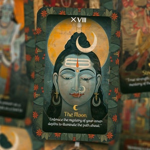 May include: A tarot card with a blue and green background featuring a painting of a deity with a crescent moon on their head. The card is labeled "XVIII The Moon" and includes the text "Embrace the mystery of your inner depths to illuminate the path ahead."