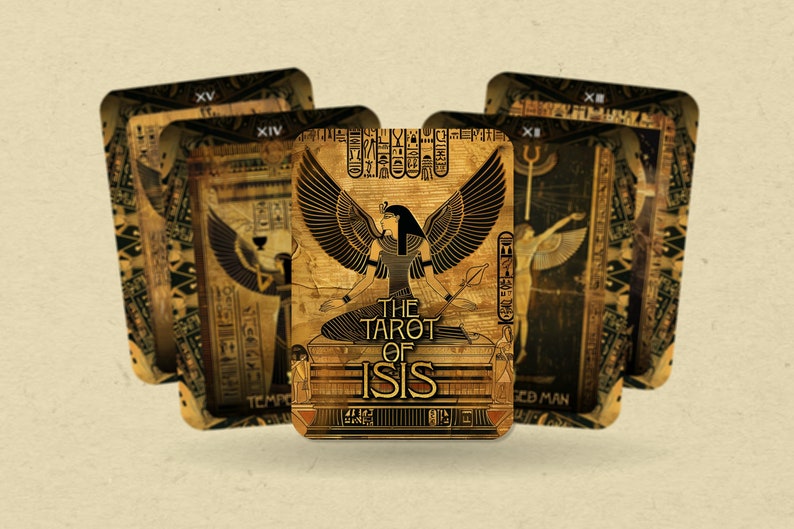 May include: A close-up of a tarot card from The Tarot of Isis deck. The card features a golden background with an image of a woman with wings, sitting on a throne. The text "The Tarot of Isis" is printed in black on the card.
