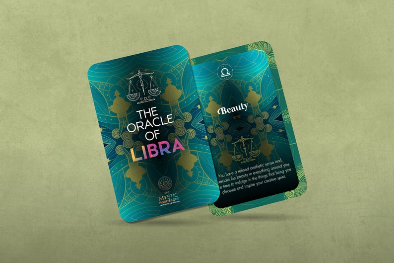 Może przedstawiać: Zielono-niebieska karta z orakulum z napisem "THE ORACLE OF LIBRA" i symbolem zodiaku Wagi. Tył karty zawiera napis "Piękno" i opis o posiadaniu wyrafinowanego zmysłu estetycznego.