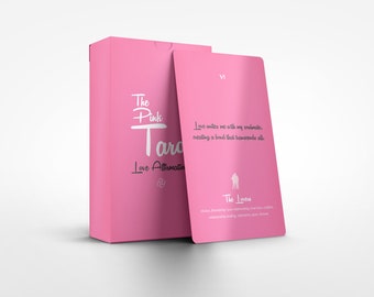 May include: A pink box with the text "The Pink Tara Love Affirmation" on the front. The box is open and a pink card with the text "VI The Lovers" is visible. The card has a white silhouette of two people holding hands.