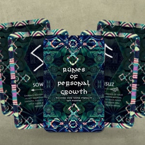 May include: A deck of tarot cards with a teal and green geometric design. The cards feature the text "Runes of Personal Growth" and other text. The cards have a decorative border with a mix of colors.