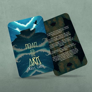 May include: A blue and gold oracle card with the text "Noah and the Ark Oracle Cards". The card features a stylized illustration of a boat on a stormy sea with a bird flying overhead.