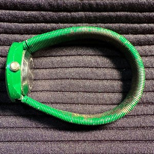 May include: A green watch with a green metal band. The watch face is round and has a gold-colored bezel.
