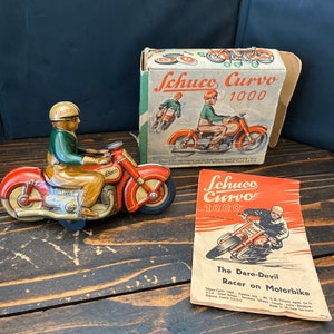Green Tin Schuco Curvo 1000 Green, Us-zone of Germany with original signed key, instructions and box. I can send video of it working.