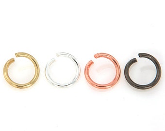 May include: Four jump rings in different metal finishes: gold, silver, copper, and black.
