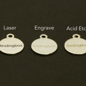 May include: Three silver round tags with the text "findingbox" engraved on them. The tags are labeled "Laser", "Engrave", and "Acid Etch" to show the different engraving methods.