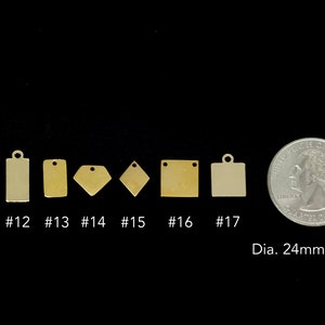 May include: Seven different sizes of brass metal tags with rounded corners and a hole at the top. The tags are arranged in a row from smallest to largest. A US quarter is shown for size comparison. The quarter measures 24mm or 0.95 inches in diameter.