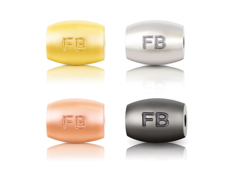 May include: Four metal beads with the letters "FB" engraved on them. The beads are in four different colours: gold, silver, rose gold, and black.