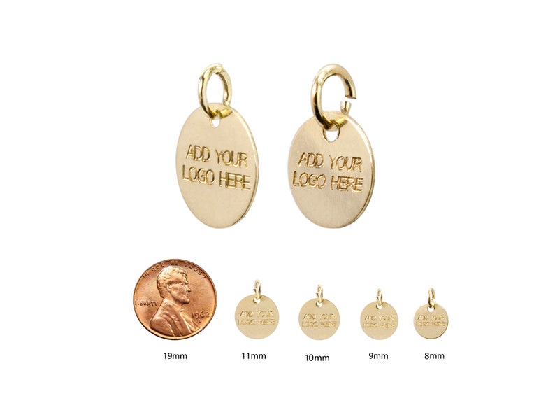 May include: Gold-colored metal disc charms with a jump ring. The charms are round and have the text "ADD YOUR LOGO HERE" engraved on them. The charms are shown in various sizes: 19mm, 11mm, 10mm, 9mm, and 8mm.