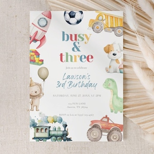 May include: A colorful birthday invitation with the text "busy & three" and "Lawson's 3rd Birthday." The design includes illustrations of a rocket, soccer ball, dump truck, puppy, dinosaur, lion, train, and monster truck.