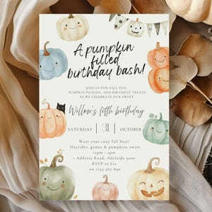 May include: A fall-themed birthday invitation with watercolor pumpkins in various colors. The text reads "A pumpkin filled birthday bash!" and includes details for Willow's fifth birthday, including date, time, and location.