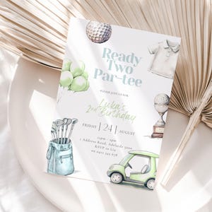 May include: A watercolor-style invitation for a second birthday party with a golf theme. The invitation features illustrations of golf balls, a golf cart, golf clubs, and the text "Ready Two Par-tee" and "Luka's 2nd Birthday".