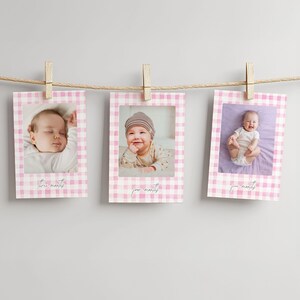 May include: Three baby photos hanging on a string with wooden clips. Each photo is in a pink and white checkered frame. The photos show babies at three, four, and five months old. The text on the photos reads 'three months', 'four months', and 'five months'.