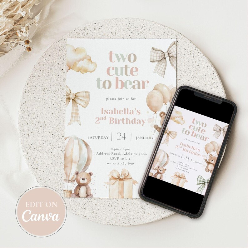 May include: A birthday invitation with the text "two cute to bear" and "Isabella's 2nd Birthday". The design includes teddy bears, balloons, bows, and a hot air balloon in soft pastel colors. A smartphone displays the same invitation.
