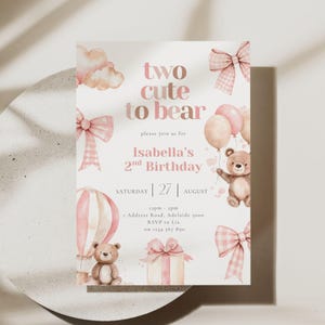 May include: A birthday invitation card featuring the text two cute to bear, Isabella's 2nd Birthday, Saturday 27 August, 12pm-2pm, 1 Address Road, Adelaide 5000, RSVP to Lia on 1234 567 890, decorated with watercolor teddy bears, pink bows, balloons, and a gift.