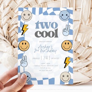May include: A blue and white checkered birthday invitation with the words "two cool" in large letters. The invitation includes smiley faces, lightning bolts, and peace signs. The text reads "Archer's 2nd birthday".