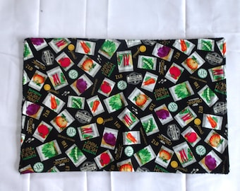Vegetable Seed Packets on a Black Background Dish Mat