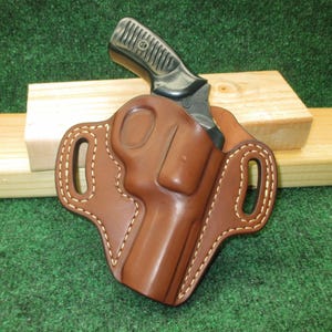 May include: A set of three ceramic nesting bowls in shades of blue, green, and white. The bowls feature a speckled glaze and a simple, modern design. Each bowl is a different size, with the largest measuring approximately 6 inches in diameter.