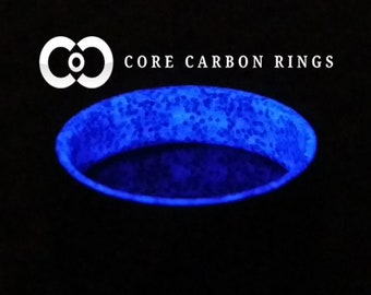 Carbon Fiber Purple Glow Ring with purple sparkle glowing interior