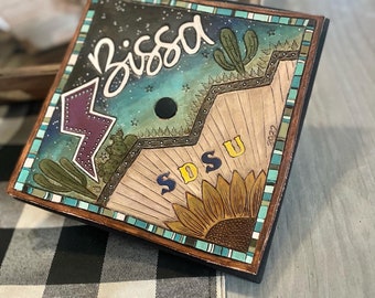 Adorno para birrete de graduación personalizado