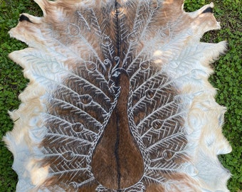 Hand carved goatskins - peacock design.