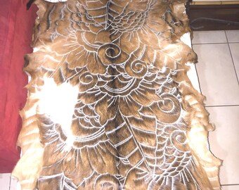 Hand carved goat skin