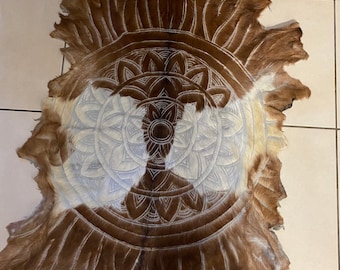 Mandala themed goat skin. Handcarved