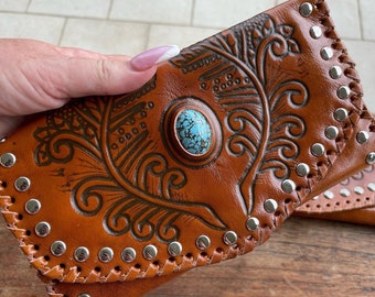 Hand tooled leather wallet with turquoise centre piece