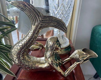 Brass mermaid.