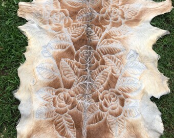 Tan and cream hand carved goat hide