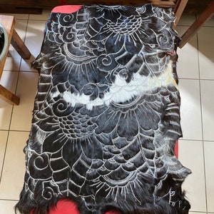 Hand carved goatskin rug.  Black and white.