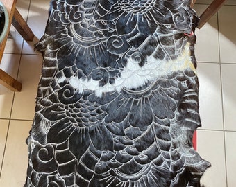 Hand carved goatskin rug.  Black and white.