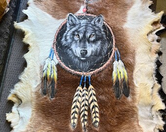 Wolf design.  Hand painted goat hide.