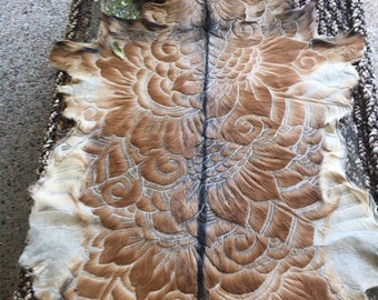 Handcarved goat hide