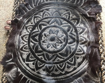 Handcarved mandala design goat hide