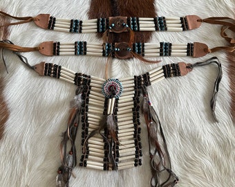 Bone tribe neck and arm bands.