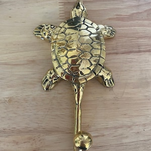 Brass turtle hook.