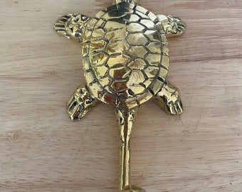 Brass turtle hook.