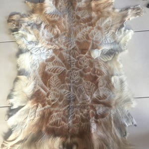 Genuine goat hide  hand carved rose design
