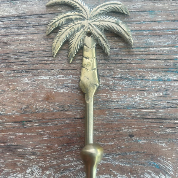 Brass hooks. Palm trees.